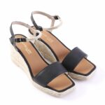 Women's black open-toe wedge espadrille sandals with braided jute platform and ankle strap with buckle.