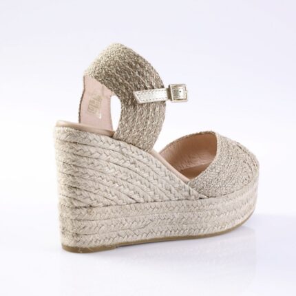 Beige woven-strap espadrille wedge sandal with ankle strap and buckle on a platform jute sole.