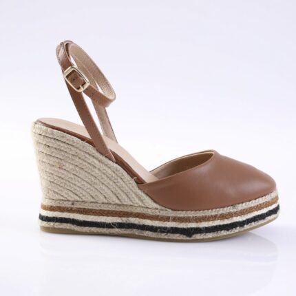 Brown leather wedge sandal with ankle strap and rope-wrapped heel, featuring a striped espadrille sole in tan, beige, and black.