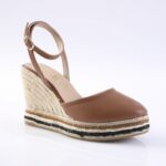 Brown leather espadrille wedge sandal with ankle strap and rope-wrapped sole, shown from a side angle.