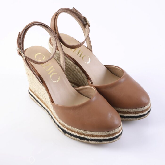 Brown leather wedge espadrille sandals with ankle strap and woven jute sole.
