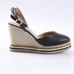 Black leather wedge sandal with an ankle strap and natural rope-wrapped platform.