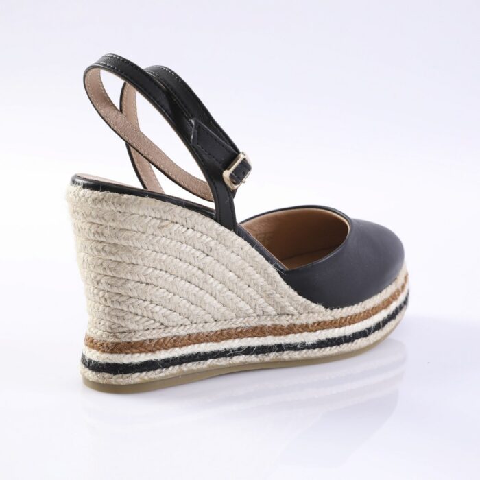 Black leather wedge sandal with an ankle strap and natural rope espadrille heel.