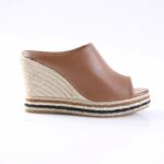 Brown leather wedge espadrille sandal with braided rope platform and beige sole edge.