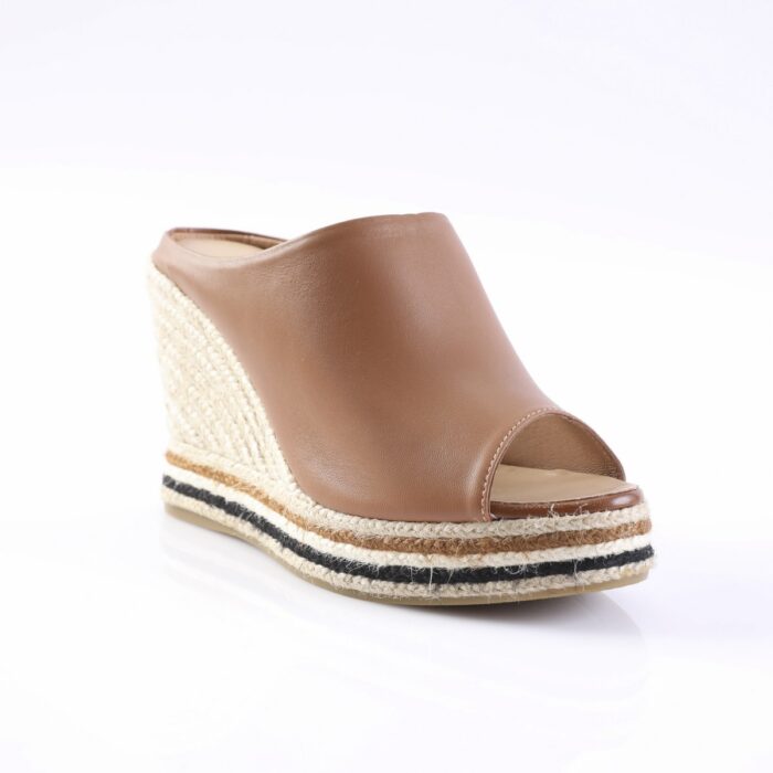 Brown open-toe wedge sandal with a braided jute sole and stacked espadrille layers featuring natural and black stripes.