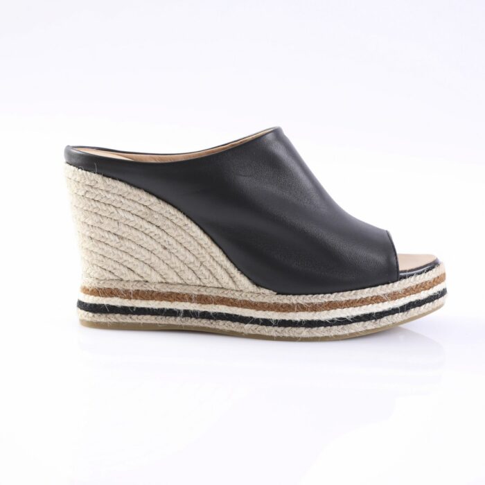 Black leather open-toe wedge sandal with a braided jute platform and striped sole edge