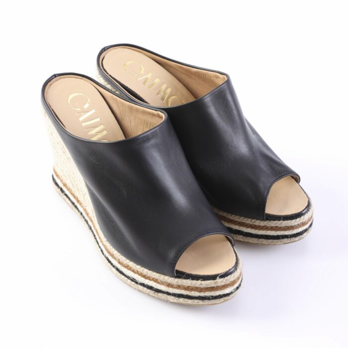 Black leather peep-toe espadrille wedge sandals with a braided rope sole, shown from the side.