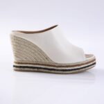 White open-toe wedge mule with braided jute heel and striped sole at the bottom.