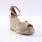 Beige open-toe espadrille wedge sandal with ankle strap and braided raffia-wrapped heel.