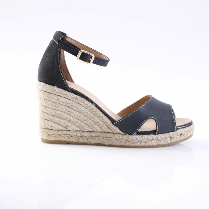Navy blue wedge sandal with ankle strap and braided jute sole for a summery look, side view.