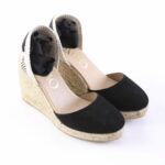 Black suede wedge espadrilles with a natural jute sole and navy ribbon ankle ties