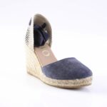 Navy blue suede espadrille wedge with a woven jute sole and striped back panel.