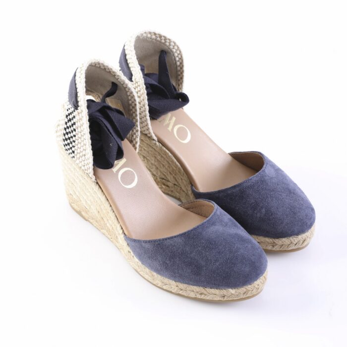 Navy suede wedge Espadrilles with braided jute sole, navy ribbons, and black-and-white checkered back panels.
