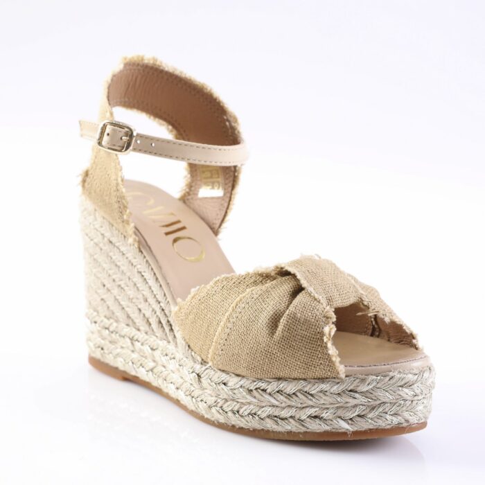 Beige espadrille wedge sandal with braided jute sole and open toe, ankle strap with buckle.