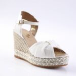 White fabric espadrille wedge sandal with ankle strap and braided jute sole, open toe.
