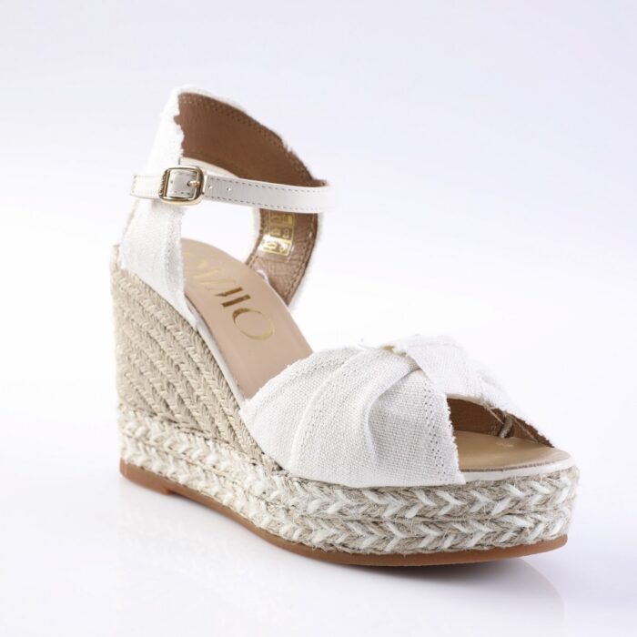 White fabric espadrille wedge sandal with ankle strap and braided jute sole, open toe.