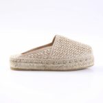 Beige woven espadrille slip-on with braided jute sole on white background