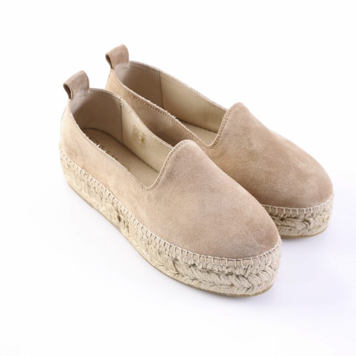 Beige suede espadrille flats with a braided jute sole on white background