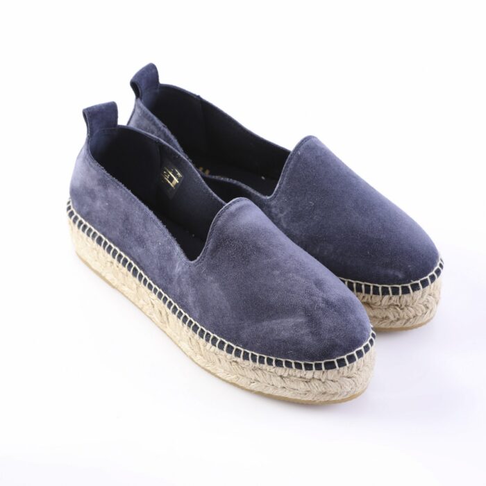 Navy blue suede espadrille flats with a rope-wrapped sole, pair shown from a side angle