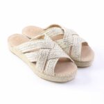 Beige woven espadrille sandals with braided straps on a white background, view of pair from front-left.