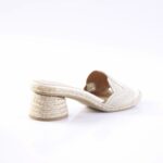 Beige woven espadrille mule with a braided rope block heel, side view
