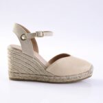 Beige leather wedge sandal with an ankle strap and braided jute platform heels.