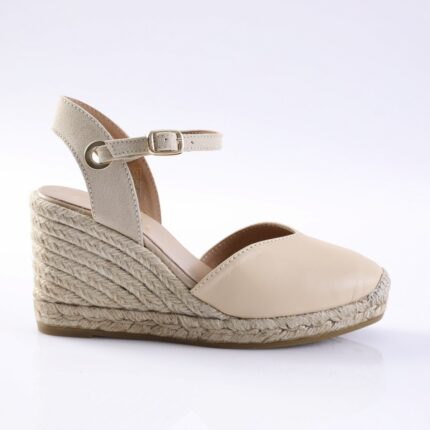 Beige leather wedge sandal with an ankle strap and braided jute platform heels.
