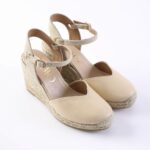 Beige wedge espadrille sandals with ankle straps and braided jute sole, front view