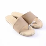 Beige open-toe sandals with a wide strap and a silver metal ring detail on a braided espadrille sole.