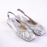 Silver metallic slingback flats with ruched toe on a white background (informational product image).$0