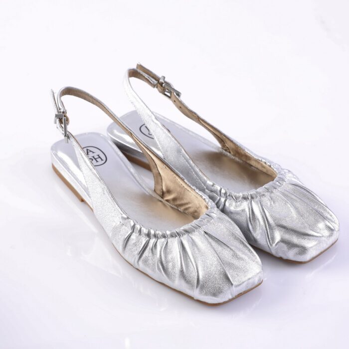 Silver metallic slingback flats with ruched toe on a white background (informational product image).$0