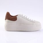 White platform sneaker with brown suede heel accent and white laces, side view.