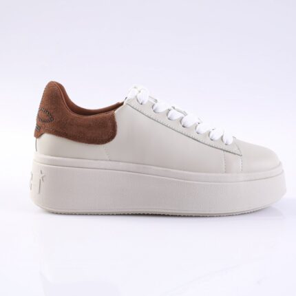 White platform sneaker with brown suede heel accent and white laces, side view.