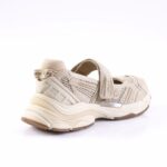 Beige chunky sandal sneaker with Velcro strap and rugged sole, viewed from the rear-right side.