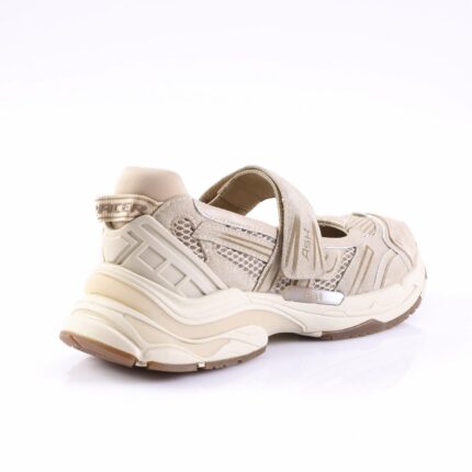 Beige chunky sandal sneaker with Velcro strap and rugged sole, viewed from the rear-right side.