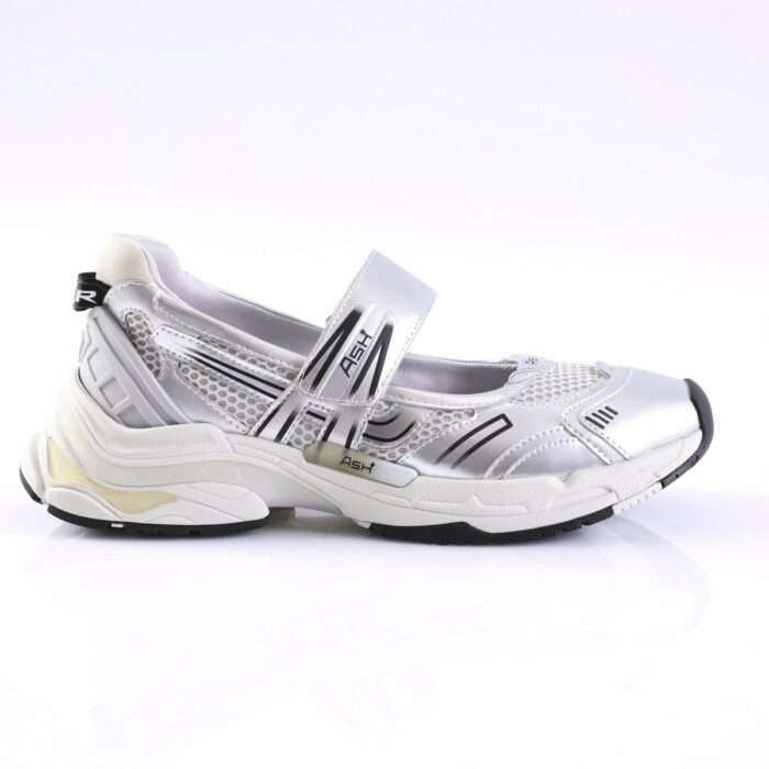 White and silver sporty sneaker with mesh panels and a Velcro strap, side view.