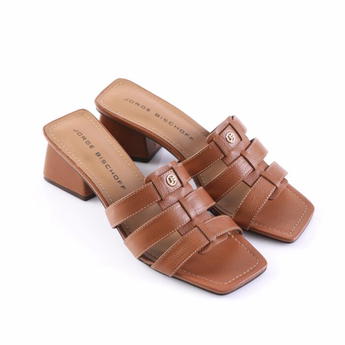 Brown leather block-heel sandals with woven straps and gold logo hardware on the upper legible brand insoles.