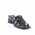 Black strappy slide sandal with a low block heel and a small gold logo accent on the strap