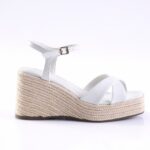 White wedge espadrille sandal with braided jute platform, white straps, and ankle buckle.