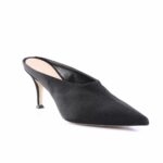 Black suede backless mule with a pointed toe and slender stiletto heel, side view