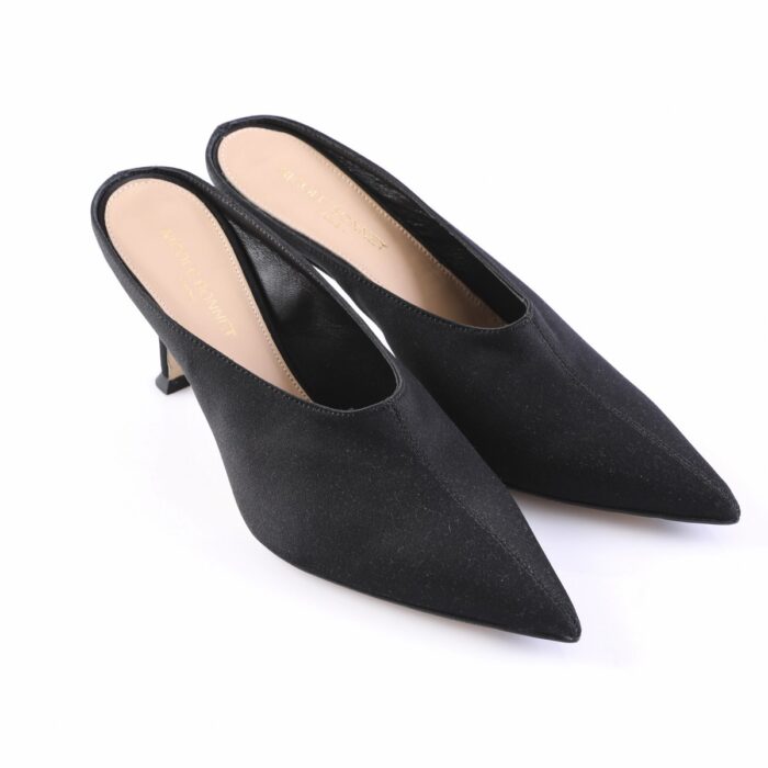 Black suede pointed-toe mules with a short kitten heel, shown from a diagonal top view.