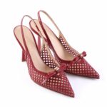 Red lattice-cutout slingback high heels with a bow on the toe area