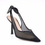 Black mesh pointed-toe high heel with an ankle-tie bow on top.