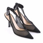 Black mesh pointed-toe high heels with knotted bow ankle straps and stiletto heels (fashion product).