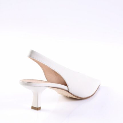 White slingback pump with a curved mid-height heel shown from the side on a white background