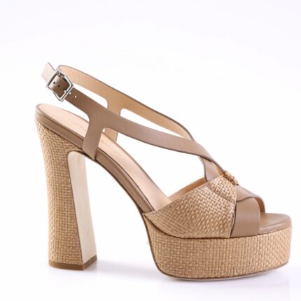 Beige wedge sandal with braided jute platform and chunky heel, featuring slim straps and a buckle ankle strap