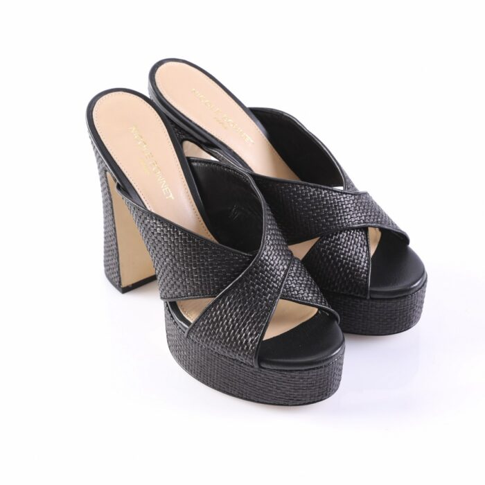 Black woven high-heeled platform mules with crisscross straps and open toes, on a white background.