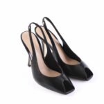 Pair of black slingback peep-toe high-heeled shoes, facing slightly inward on a white background, showcasing the stylish open toe design and slim straps.