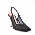 Black mesh slingback high-heel shoe with open toe and beige insole, featuring a delicate ankle strap and dotted mesh pattern.