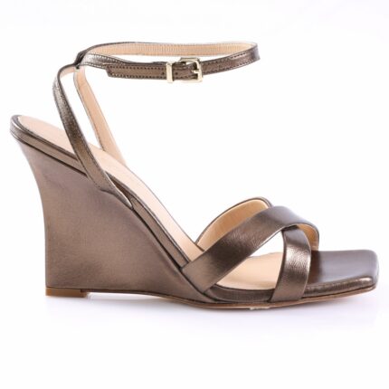 Bronze metallic wedge sandal for women with an ankle strap and open toe, shown from the side on a white background.